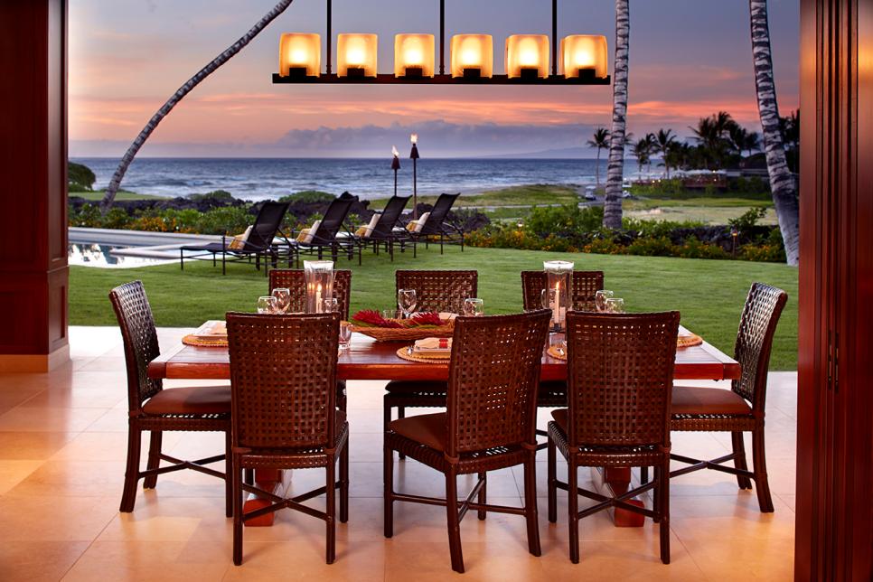 Contemporary Brown Outdoor Dining Table and Chairs With Ocean Behind