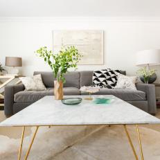 Smooth Marble Coffee Table Adds Contrasting Texture in Modern Living Room