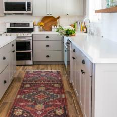 Wood Accents and Oriental Rug Add Color and Warmth to Farmhouse Kitchen