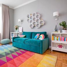Little Girl's Nursery with Symmetrical Book Cases and a Comfortable Sofa