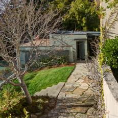Sloping Stone Path Leads to State of the Art Versatile Out Building