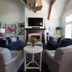 Contemporary Family Room With Neutral Armchairs and Blue Sofas