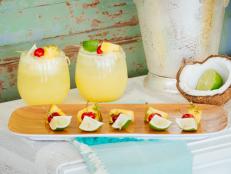 Pineapple, Coconut and Lime Cocktail Displayed With Garnishes