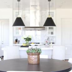 White Eat-In Kitchen With Black Pendants