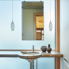 Asian Bathroom Floating Vanity With Frosted Glass Window Background, Hanging Mirror and Pendant Lights 