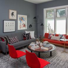 Midcentury Modern Red Sofa and Gray Sofa in Charcoal Living Room With Bright Red Chairs and Gray and White Area Rug