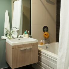 Contemporary Bathroom With Woodgrain Floating Vanity, White Bathtub and Large Rainfall Shower Head 