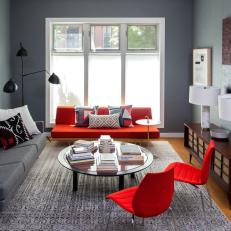 Bright Red Accent Pieces in Gray Contemporary Living Room With Vintage Media Cabinet and Large Area Rug