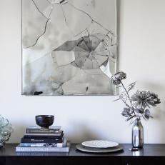 Living Space Shines With Silver Artwork and Console Tableau