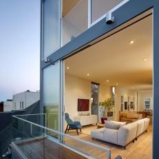 Living Room and Balcony With Glass Wall
