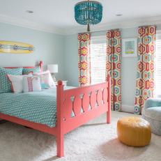 Blue and Orange Girl's Bedroom With Yellow Pouf