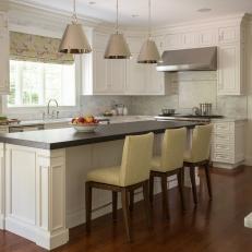 White Cottage Kitchen With Yellow Barstools
