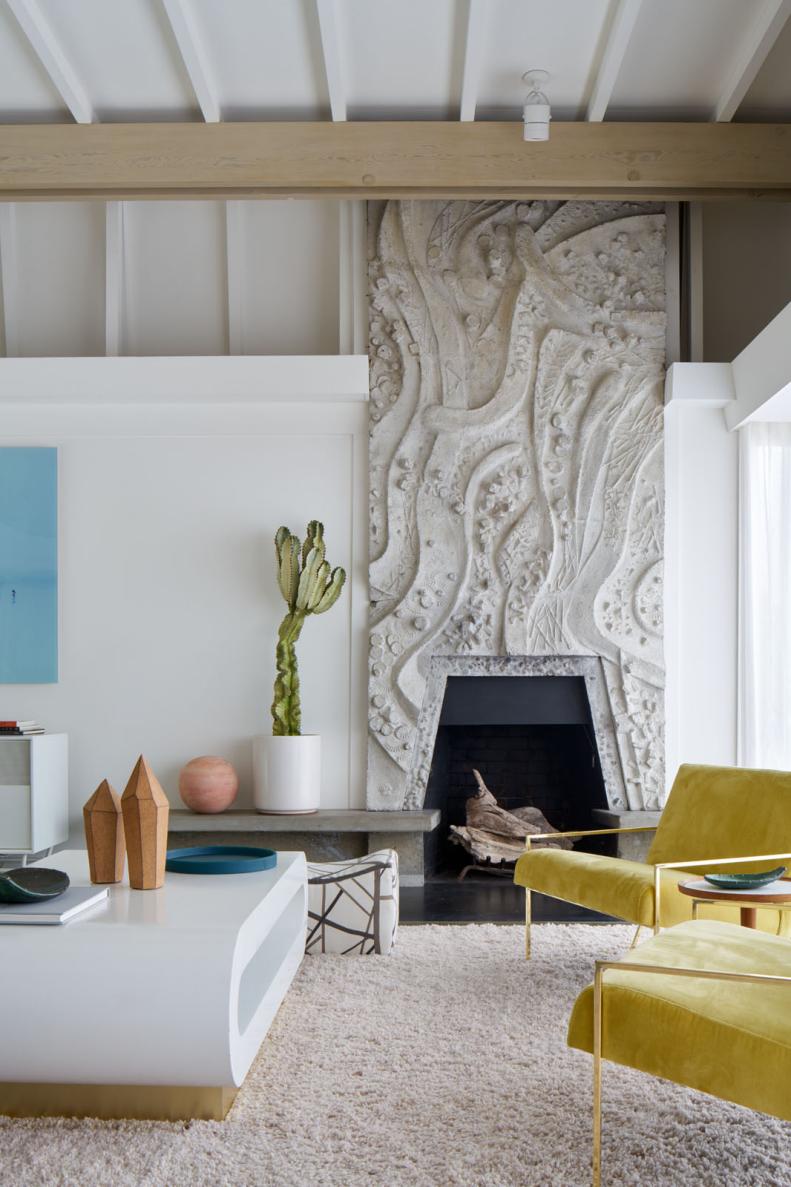 White Modern Living Space With Fireplace, Yellow Chairs & White Coffee Table