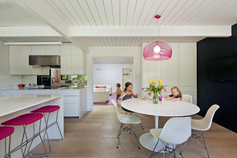 White Modern Kitchen With Pink Barstools & Pendant Light