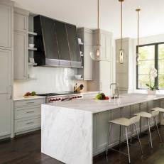 Gray and White Transitional Kitchen With Bronze Hood
