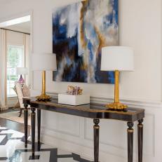 Black and Gold Console Table and Art