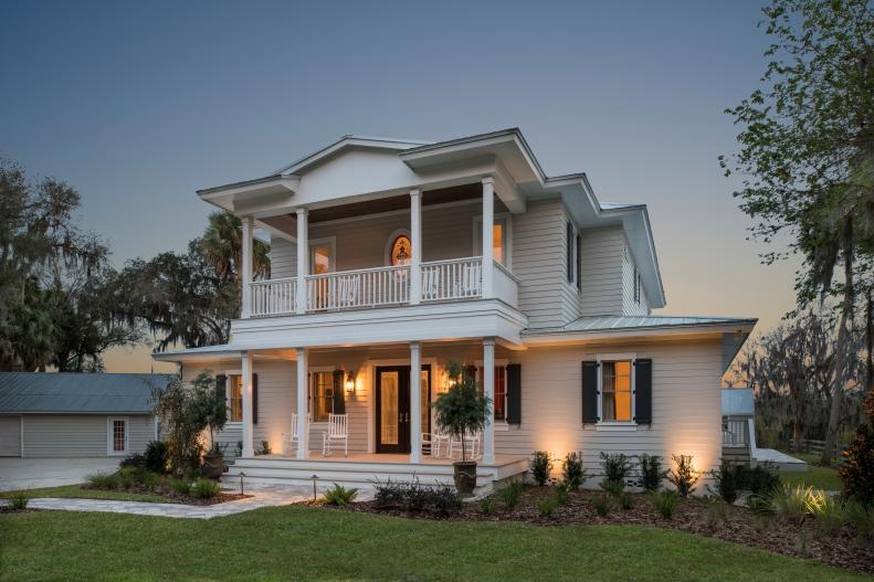 Neutral Home With Black Shutters and Two Porches