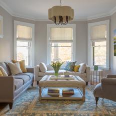 Neutral Transitional Living Room With Upholstered Coffee Table