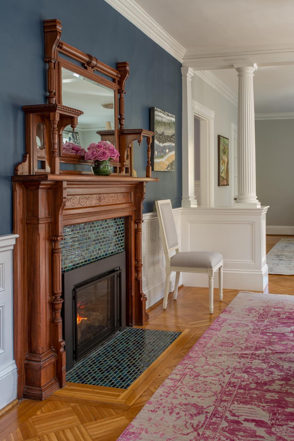 Fireplace With Green Tiles and Ornate Wooden Mantel | HGTV