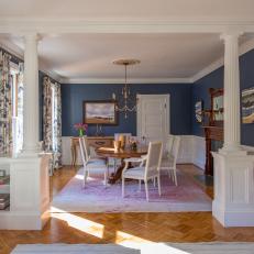 Blue Dining Room With Parquet Floor and White Columns