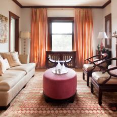 Transitional Living Room With Red Velvet Ottoman