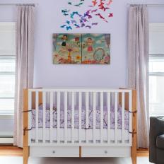 Contemporary Nursery With Rainbow Mobile