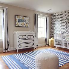 Neutral Midcentury Nursery With Bold Wallpapered Accent Wall
