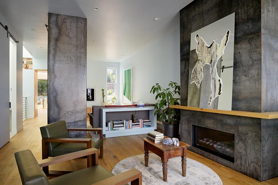 White Modern Living Room With Green Armchairs, Steel Fireplace