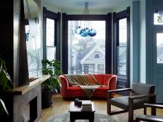 Modern Blue Living Room With Bay Window & Orange Sofa
