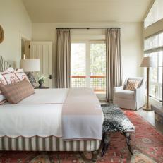 Neutral Transitional Bedroom With Red Rug