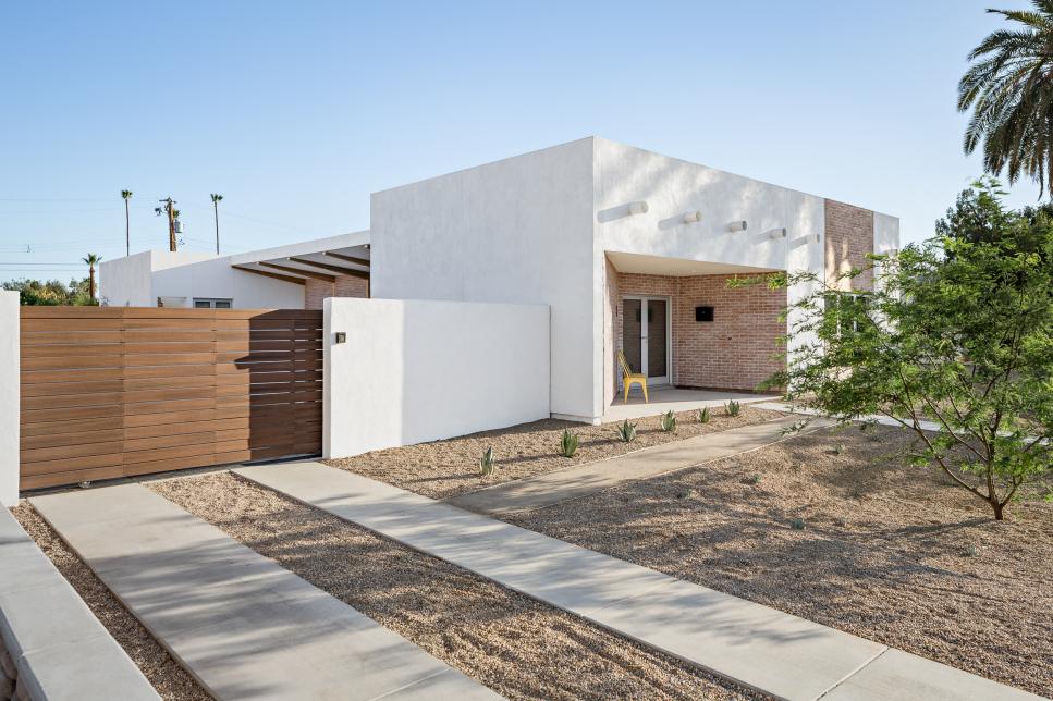 Home With White Stucco and Red Brick Exterior