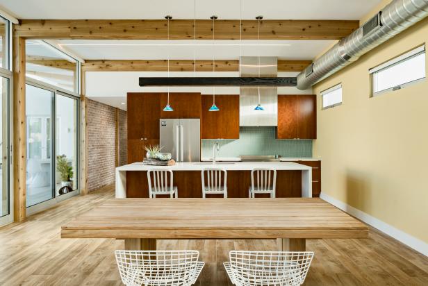 Kitchen With Wooden Cabinets, Exposed Beam Ceiling and Dining Area