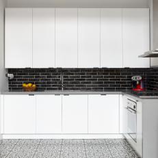 White Modern Kitchen With Black Backsplash