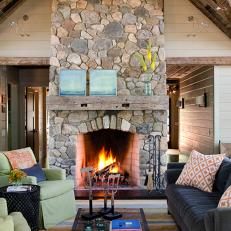 Tall, Rustic Fireplace in Cozy Living Room 