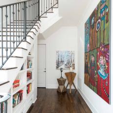 White Foyer With Colorful Art