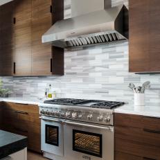 Midcentury Modern Kitchen with Stainless Range and Walnut Cabinetry