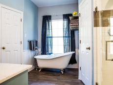 As seen on House Hunters Renovation, this renovated Austin, Texas bathroom has a
classic design with vintage touches with gray and blue accents. It features furnishings such as towels, tub caddy, and  hammered metal soap dish, tumbler , lotion pump and tissue holder from Macy's.(After)