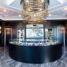 Lavish Macaron Bakery With Brass Chandelier & Glass Display