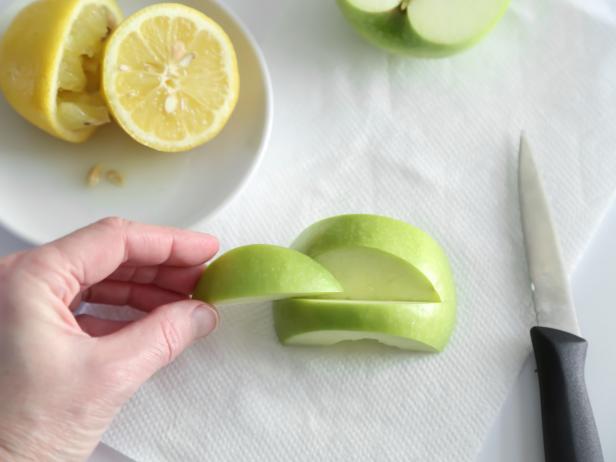 Cut away slices from the centers of the apples using a paring knife.