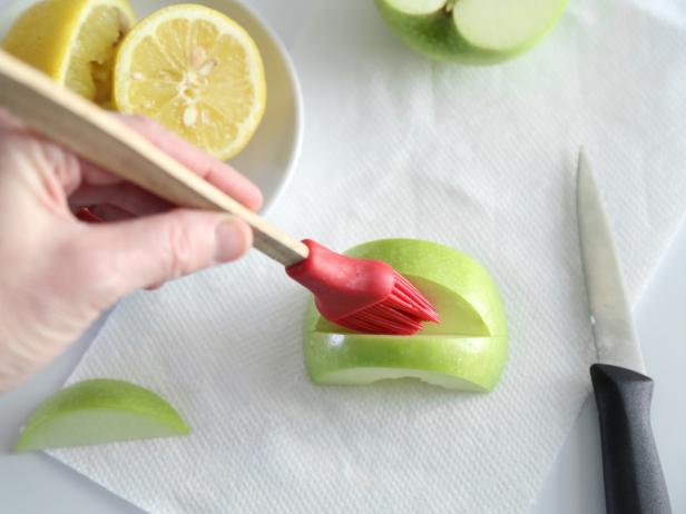 Brush the exposed apple flesh with lemon juice to prevent browning.