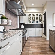 Contemporary Kitchen With Light and Dark Subway Tile Backsplash, Neutral and Black Granite Countertop and X Mullion Cabinets