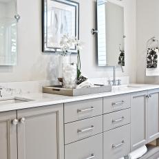 Bright, Transitional Double Vanity Bathroom With Gray Cabinets, White Marble Countertop and Mounted Mirrors 