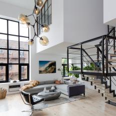 White Urban Living Room With Staircase