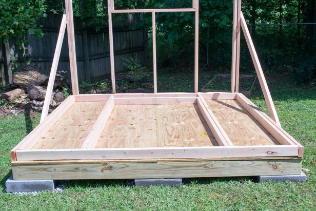Lay out the wall frames on the floor. The front and rear walls will be the full width of the floor, and so they will be built first and second.