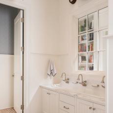 Triple Faucet Sink and Brick Floor in Traditional Mudroom With White Cabinet Storage 