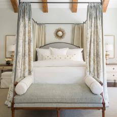 Sophisticated, Traditional Master Bedroom With Soft Floral Bed Curtains, Crisp White Linens and Upholstered Bed Bench 