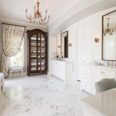 White Marble Floor in Traditional Master Bathroom With Glass Door Towel Cabinet and Gold Chandelier 