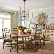 Shabby Chic Dining Room With Mint Green Walls, Vintage Chandelier and Round Wood Dining Table