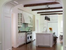 White Cottage Kitchen With Arched Entrance