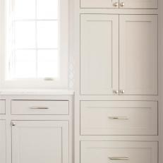 White Cabinets With Stainless Steel Knobs and Handles Built Into Transitional Kitchen Design 